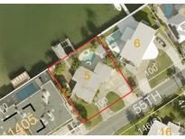 Aerial view shows a home with a pool and waterfront access at 205 55Th Ave, St Pete Beach, FL 33706