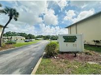 Summer Lakes community sign with attractive landscaping in a well-maintained neighborhood at 4805 Rilma Ave # 106, Sarasota, FL 34234
