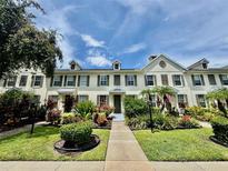 Charming townhouse showcasing a beautifully landscaped front yard and inviting walkway at 5620 Whitehead St, Bradenton, FL 34203