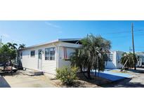 Charming single-story home with white siding and a well-maintained yard, offering a cozy and inviting curb appeal at 10315 Cortez W Rd # 24-2, Bradenton, FL 34210
