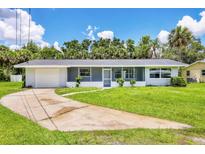 Charming single-story home features a well-maintained lawn and an attached garage at 116 Myakka Dr, Venice, FL 34293