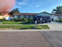 Charming single-story home with well-manicured lawn and mature landscaping in a desirable neighborhood at 1209 Croydonwood Cir, Brandon, FL 33510