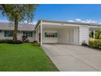 Charming home featuring a covered carport, well-manicured lawn, and inviting curb appeal at 4414 Mount Vernon Dr # 1, Bradenton, FL 34210