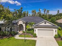 Charming single-story home featuring a manicured lawn, beautiful landscaping, and a two-car garage at 1508 86Th Nw Ct, Bradenton, FL 34209