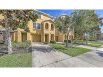 Charming multi-level townhome featuring well-maintained landscaping, front yard and private garage at 8907 White Sage Loop, Lakewood Ranch, FL 34202