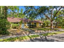 Charming single-story home with a well-maintained lawn and mature trees providing ample shade at 218 32Nd W St, Bradenton, FL 34205