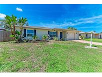 Charming single-story home with a well-maintained lawn and beautiful, mature landscaping at 8321 43Rd Ave W, Bradenton, FL 34209