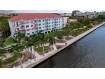 Beautiful condo building with waterfront views and lush tropical landscaping at 210 3Rd W St # 8308, Bradenton, FL 34205