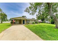Charming single-story home with well-maintained lawn and concrete driveway at 237 Saxon Cir, Venice, FL 34293