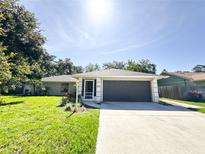 Charming single-story home with a well-manicured lawn and a two-car garage at 4913 32Nd E St, Bradenton, FL 34203