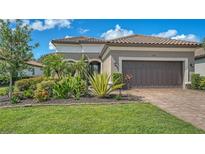 Beautiful single-Gathering home with a two-car garage and lush landscaping at 5234 Napoli Run, Bradenton, FL 34211