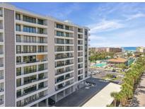 Upscale condo building with balconies offering stunning ocean views and convenient parking at 6415 Midnight Pass Rd # 502, Sarasota, FL 34242