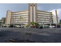 Attractive condominium building with covered parking, stone accents, and meticulous landscaping at 3680 Ironwood Cir # 603L, Bradenton, FL 34209