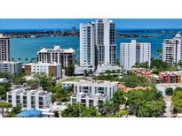 Beautiful aerial view of the condo community with water views in the background at 626 Rawls Ave # 626, Sarasota, FL 34236