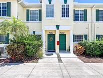 Charming townhome exterior with green shutters, well-maintained landscaping, and inviting front doors at 245 Cape Harbour Loop # 103, Bradenton, FL 34212