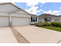 Charming single-story home featuring a two-car garage and well-maintained landscaping at 407 157Th E Ct, Bradenton, FL 34212