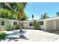 Charming single-story home with well-maintained landscaping and a driveway at 4214 Groveland Ave, Sarasota, FL 34231
