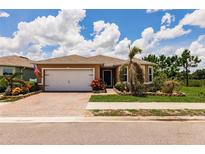 Charming single-story home featuring a brick driveway and well-maintained landscaping at 5301 Shell Mound Cir, Punta Gorda, FL 33982