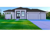 Modern home showcasing a well-manicured lawn, a three-car garage, and a sleek architectural design at 1573 Greenley Rd, North Port, FL 34286
