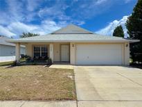 Charming single-story home featuring a two-car garage and a cozy front porch at 2122 Pleasure Run Dr, Ruskin, FL 33570