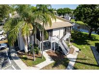 Charming condo with palm trees, exterior stairwell, lakeside fountain views, and ample parking at 3539 59Th W Ave # 3539, Bradenton, FL 34210