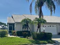 Charming single-story home with well-maintained landscaping and attached two-car garage at 4107 Brittany Ln # 18, Sarasota, FL 34233