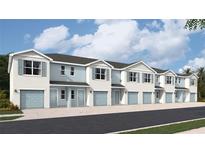 Charming townhome exterior featuring blue accents, a one car garage and well manicured landscaping at 4522 Stargazer Ct, Palm Harbor, FL 34683