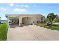 Charming single story home with a covered carport and well maintained lawn at 617 Fairmount Dr, North Port, FL 34287