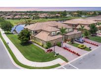 Expansive waterfront home boasts manicured landscaping and a three-car garage at 6512 Grand Estuary Trl # 101, Bradenton, FL 34212