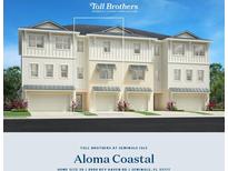 Beautiful three-story home featuring light color palettes, three garage doors, and a well maintained yard at 9990 Key Haven Rd, Seminole, FL 33777