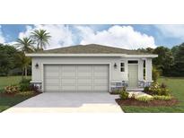 Charming single-story home featuring a two-car garage, stone accents, and well-manicured landscaping at 3222 Bitterroot Ln, Lakewood Ranch, FL 34211