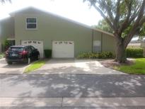Charming home featuring a two-car garage and a well-maintained front yard at 4154 Center Pointe Cir # 57A, Sarasota, FL 34233
