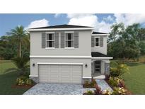 Charming two-story home with a neutral color scheme, gray shutters and stone accents on a landscaped yard at 1910 Cobb Trl, Parrish, FL 34219