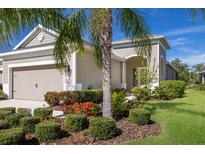 Charming single-Gathering home boasts lush landscaping and a well-manicured lawn, complemented by a two-car garage at 4609 Deep Creek Ter, Parrish, FL 34219