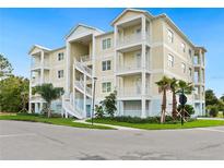 Stunning three-story building with lovely balconies and a beautifully landscaped exterior in a tropical setting at 7611 34Th W Ave # 301, Bradenton, FL 34209