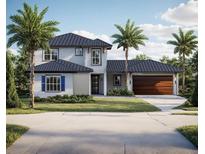 Charming two-story home boasts a classic design with palm trees and a well-manicured lawn at 7809 20Th W Pl, Bradenton, FL 34209