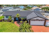 Charming single-story home featuring a well-manicured lawn and inviting curb appeal at 8001 13Th S Ave, St Petersburg, FL 33707
