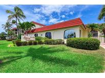 Beautiful Las Siesta Condominium with lush landscaping and a classic red tile roof in a desirable location at 915 Beach Rd # 321, Sarasota, FL 34242