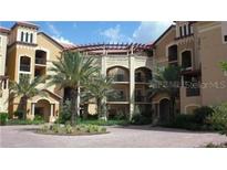 Mediterranean-style building with multiple levels and lush landscaping at 97 Vivante Blvd # 9749, Punta Gorda, FL 33950