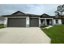 Two-car garage and attractive curb appeal at 2563 Longworthy Rd, North Port, FL 34288