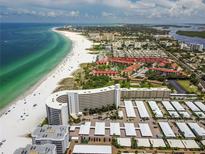 Aerial view of beachfront property with ocean, beach, and condo buildings at 6300 Midnight Pass Rd # 20, Sarasota, FL 34242