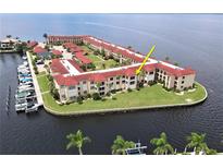 Aerial view of waterfront condo building highlighting unit location at 1 Colony Point Dr # 5C, Punta Gorda, FL 33950