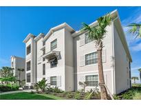 Modern building exterior with attractive landscaping at 43020 Greenway Blvd # 312, Punta Gorda, FL 33982