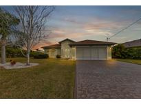 Charming single-story home with a landscaped yard at 176 Jennifer Dr, Rotonda West, FL 33947