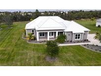 Single-Gathering home with metal roof and landscaping at 28968 Gin Ln, Punta Gorda, FL 33982