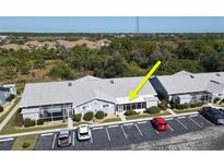 Aerial view of a condo building and parking lot at 3300 Loveland Blvd # 1304, Port Charlotte, FL 33980