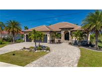 Single-Gathering home with three-car garage and stone accents at 669 Monaco Dr, Punta Gorda, FL 33950