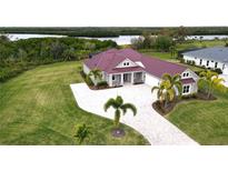 Luxury home with metal roof, paver driveway & waterfront view at 2049 Treasure Ln, Punta Gorda, FL 33982