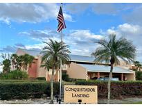 Conquistador Landing community with lush landscaping at 1354 Rock Dove Ct # A202, Punta Gorda, FL 33950