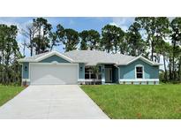 Single-Gathering home with a two-car garage and landscaped yard at 2552 Jacobs St, Port Charlotte, FL 33953